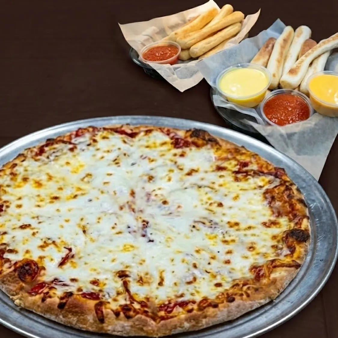 Party Special One 20" Hand-Tossed Pizza with up to 2-topping and a family order of breadsticks with two dipping sauces.